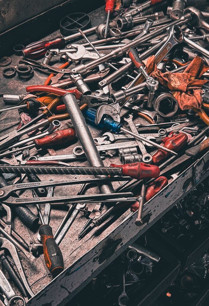 A cluttered workbench with various hand tools in a garage setting, vibrant and detailed.
